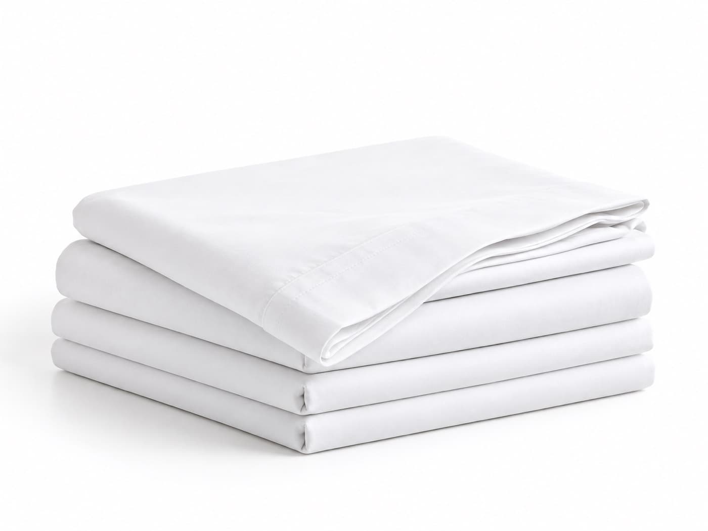 A stack of folded white cotton flat sheets